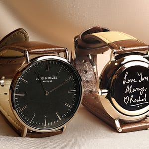 a couple of watches sitting next to each other