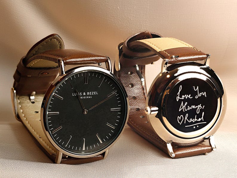 a couple of watches sitting next to each other