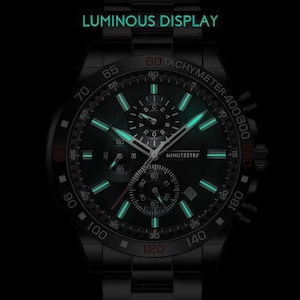 a black watch with a green light on it
