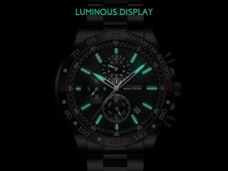 a black watch with a green light on it