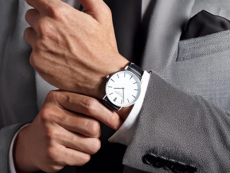 a close up of a person wearing a watch