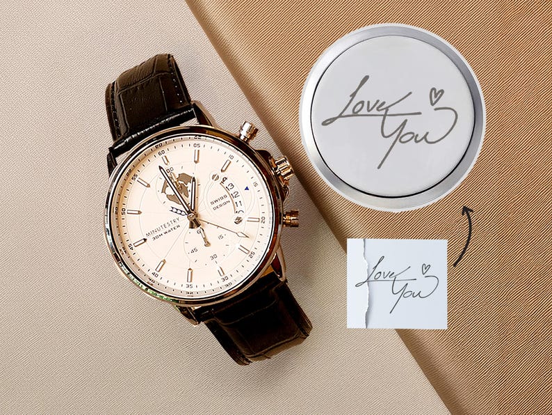 a watch sitting on top of a table next to a tag