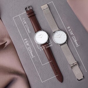 a couple of watches sitting on top of a table