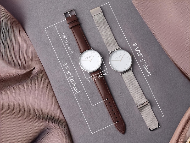 a couple of watches sitting on top of a table