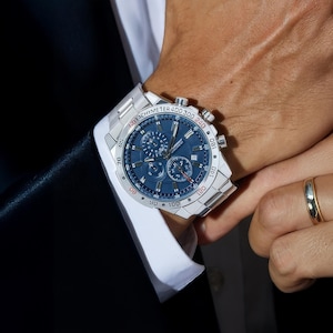 a close up of a person wearing a watch