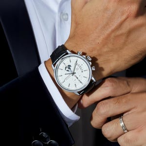 a close up of a person wearing a watch