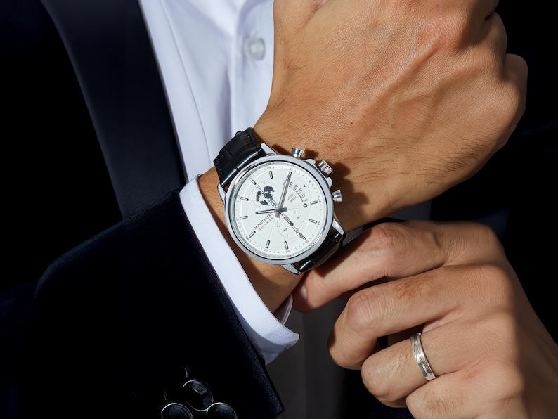 a close up of a person wearing a watch