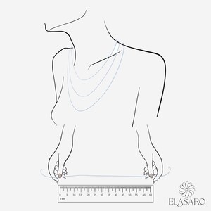 May include: A line drawing of a person wearing a layered necklace. A ruler is shown below the person's hands, with measurements in centimeters from 0 to 65.
