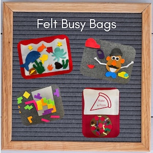May include: Four felt busy bags with different themes. The first bag has a red border and features a blue whale, an octopus, and other sea creatures. The second bag has a red heart, a brown potato head, and other facial features. The third bag has a variety of colorful felt squares. The fourth bag has a red border and features a pizza with toppings. The text "Make a Pizza" is printed on the bag.
