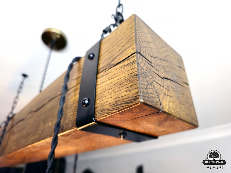 May include: A rustic wooden ceiling light fixture with black metal accents and exposed wiring. The fixture is made from reclaimed wood and has a natural finish.
