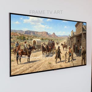 May include: A framed artwork depicting a Western scene with cowboys on horseback, stagecoaches, and a town with wooden buildings. The artwork is displayed on a white wall. The text "FRAME TV ART" is visible at the top.