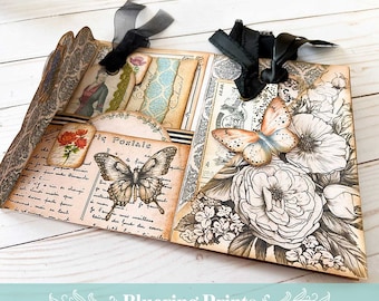 Peut inclure: Un artisanat en papier fait main avec une esthétique vintage. L'artisanat en papier présente un papillon, des fleurs et du texte en français. L'artisanat en papier est décoré d'un ruban noir et plié en forme de livre.