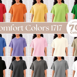 May include: A collection of 20 plain t-shirts in various colors, including red, orange, yellow, green, blue, purple, pink, beige, black, gray, and white. The t-shirts are all the same style and fit, with short sleeves and a crew neck. The text "Comfort Colors 1717" and "1 Image in 70+ Colors" is displayed on the image.