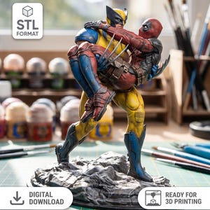 May include: A 3D printed figurine featuring Wolverine in a yellow and blue suit carrying Deadpool in a red and black suit. The characters stand on a rocky base. Text on the image includes STL FORMAT, DIGITAL DOWNLOAD, and READY FOR 3D PRINTING.