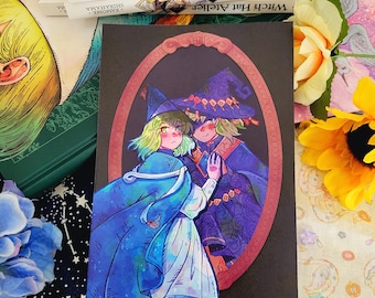 May include: A print featuring two characters from the manga "Witch Hat Atelier". The characters are a young woman with green hair and a young man with brown hair. They are both wearing hats and standing in front of a mirror. The background is a dark blue colour.