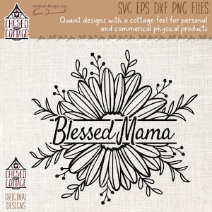 May include: Black and white line art design of a daisy with leaves and the text "Blessed Mama" in a banner below the flower.