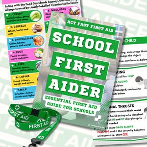 May include: A green and white "School First Aider" guide for schools, with a matching lanyard. The guide lists essential first aid information and is surrounded by other informational sheets about allergens and first aid procedures.