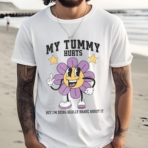 My tummy hurts shirt But I'm Being Really Brave About It tshirt stomach ache survivor gift vintage varsity aesthetic grunge graphic