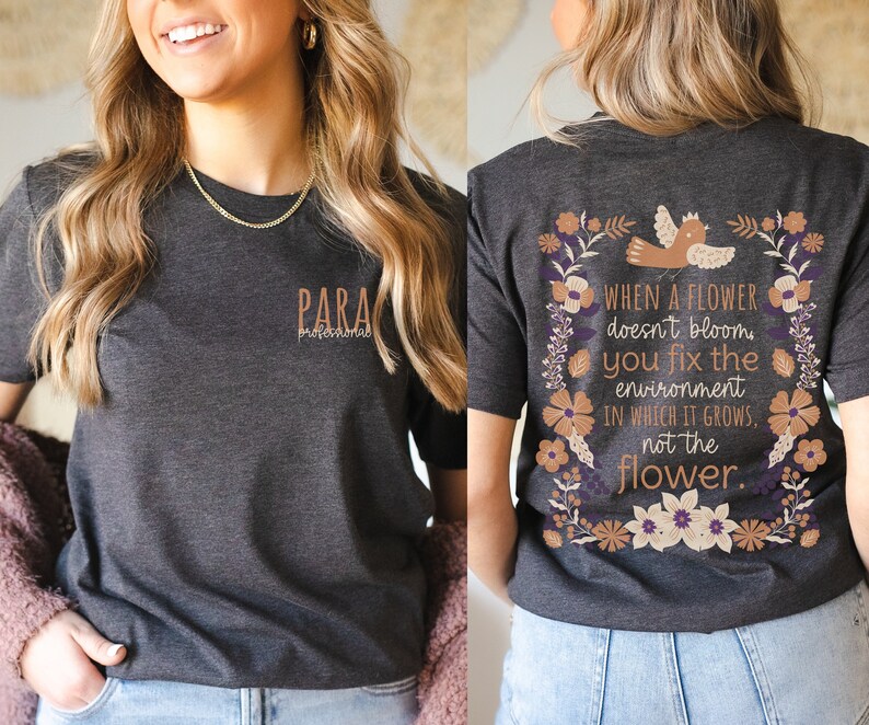 May include: A dark gray t-shirt with a floral design and the text "WHEN A FLOWER doesn't bloom you fix the environment IN WHICH IT GROWS, not the flower." on the back. The front of the shirt has the text "PARA profesional" in brown.