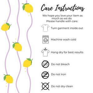 May include: Care instructions graphic with text and icons. The text reads: "Turn garment inside out, machine wash cold, hang dry for best results, do not bleach, do not iron, do not dry clean." Yellow lemons and purple wavy lines decorate the background.