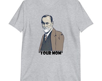 May include: A grey t-shirt with a black and white illustration of a man with a beard and mustache. The text "YOUR MOM" is printed below the illustration.