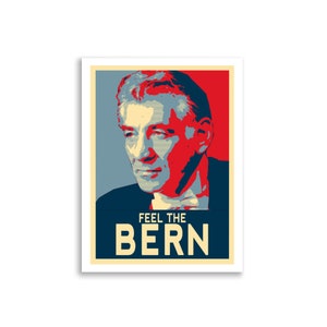 May include: A red, white, and blue poster with a portrait of a man. The poster says "Feel the Bern" in large, white letters.