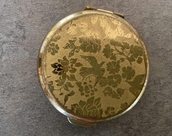 Round Nina Ricci L’Air du Temps compact with mirror 1.5 inches in diameter./gold plated