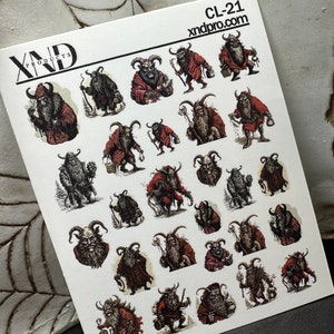 May include: A sheet of stickers with illustrations of Krampus figures in different poses. The stickers are in red, black, and grey, with the text "XND PRODUCTS" and "CL-21 xndpro.com" printed on the top.
