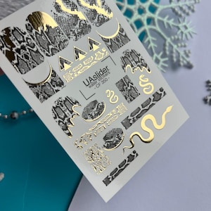 May include: A set of three ceramic mugs with a speckled, matte finish. The mugs are in cream, light grey, and dark grey. Each mug has a simple, minimalist design, ideal for coffee or tea.