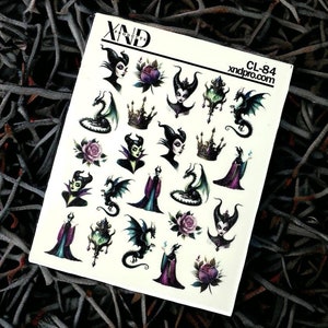 May include: A sheet of nail art stickers featuring Maleficent from Disney's Sleeping Beauty. The stickers include images of Maleficent, her dragon, a rose, a crown, and a magic staff. The sheet is labelled "XND Products" and "CL-84 xndpro.com".