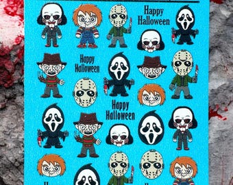 May include: A sheet of blue stickers featuring various horror movie characters, including Freddy Krueger, Jason Voorhees, and Ghostface. The stickers are arranged in a grid pattern and each sticker has a different character. The text "Happy Halloween" appears on several of the stickers.