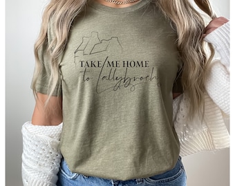 May include: A green t-shirt with a graphic of a house and the text "TAKE ME HOME to Lallybroch".