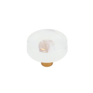 May include: A white glass cabinet knob with a gold base. The glass has a cloudy, textured appearance.