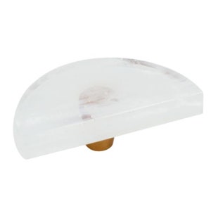 May include: White half-round cabinet knob with a gold metal base.