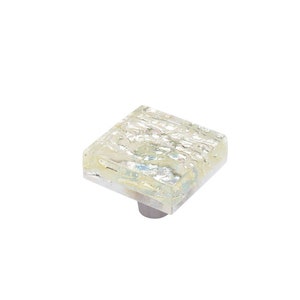 May include: Square glass cabinet knob with a textured, iridescent finish. The knob is mounted on a silver base.