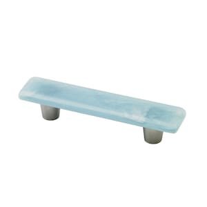 May include: A light blue glass cabinet pull with silver metal mounting hardware.