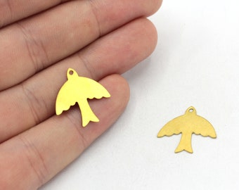 May include: Two gold-colored metal bird charms. The charms are in the shape of a bird with outstretched wings. The charms are about 1 inch in length.