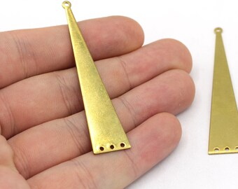 May include: Two gold-toned metal triangle pendant charms with three holes at the bottom. The charms are about 2 inches long.