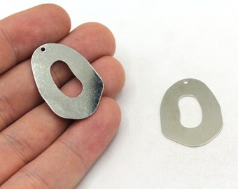 May include: Two silver metal charms shaped like the letter O with a hole in the center. The charms are irregular in shape and have a slightly textured surface.