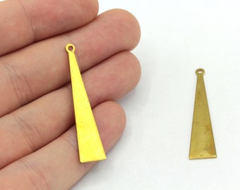 May include: Two gold-colored metal triangle pendant charms with a loop at the top. The charm on the left is a bright yellow color, while the charm on the right is a more muted gold color.