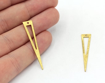 May include: Two gold-toned metal triangle shapes with a hole at the top. The larger triangle is about 2 inches long and the smaller triangle is about 1 inch long.