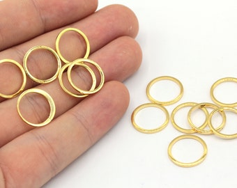 May include: A set of 10 gold-colored metal jump rings. The rings are approximately 1/2 inch in diameter.