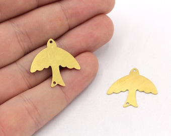 May include: Two gold-colored metal bird charms with a hole at the top for hanging. The charms are in the shape of a stylized bird with outstretched wings.