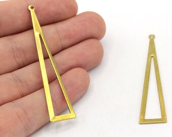 May include: Two brass-colored, open-frame triangle pendants. One pendant is held in a hand, and the other is on a white surface. Each pendant has a small hole at the top for stringing.