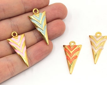 May include: Four gold-tone arrow-shaped pendants with enamel detailing. The pendants are in shades of pink, blue, orange, and white.