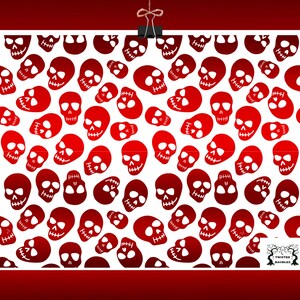 May include: A white background is covered with a pattern of red skulls in various sizes and orientations. The skulls have detailed features, including eye sockets, noses, and teeth. The image is held by a black clip and a string.