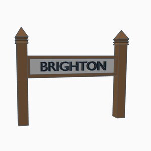May include: A wooden sign with a pointed top on each side. The sign reads "BRIGHTON" in black letters on a gray background.
