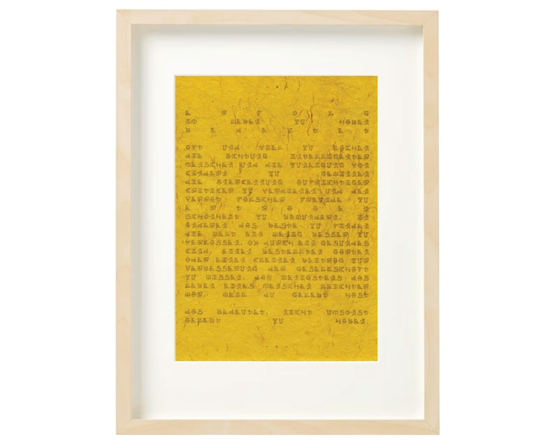 May include: A yellow paper with a framed image of a text document. The text is in a dark brown colour and is difficult to read. The text includes the words "YOU" and "HOUSE".