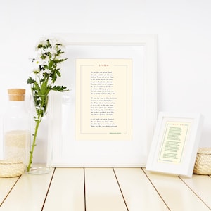 May include: Two white picture frames with a poem printed inside. The poem is titled "Dover." The frames are on a white wooden surface with a vase of white flowers and a small woven basket.