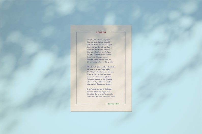 May include: A vintage-style print of a poem titled "Stufen" by Hermann Hesse. The poem is written in German and is printed on a cream-colored background with a blue border.